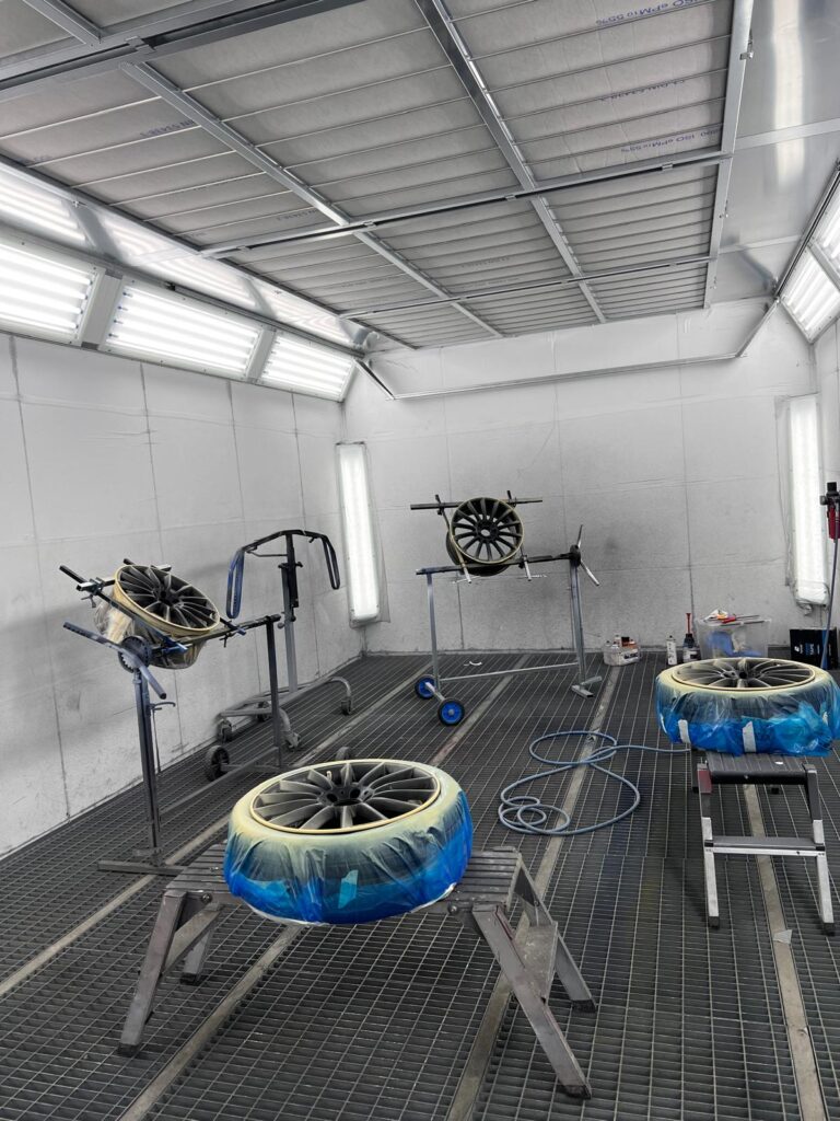 wheels fixed for painting in a spray booth of our topgear bodywork